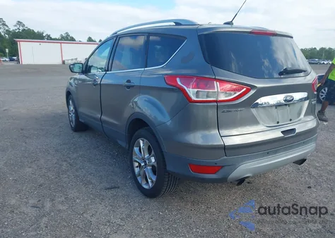2014 Ford Escape Titanium z USA, uszkodzony, nr VIN 1FMCU0JX7EUC64583